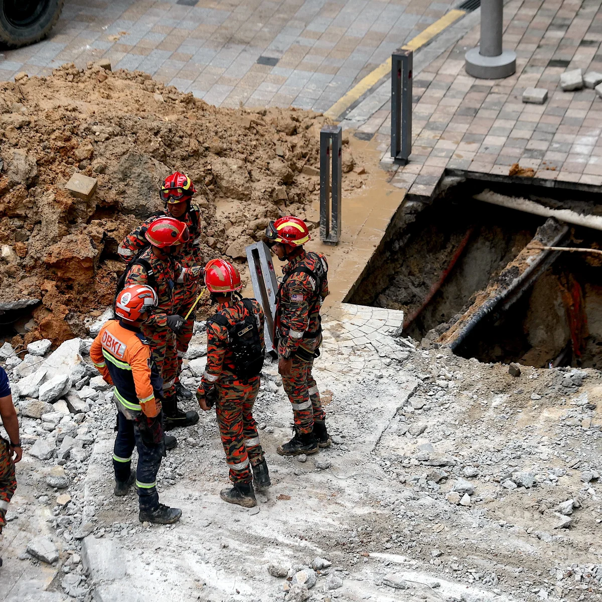Pavement Collapse in Kuala Lumpur: Woman Missing After Sinkhole Swallows Road